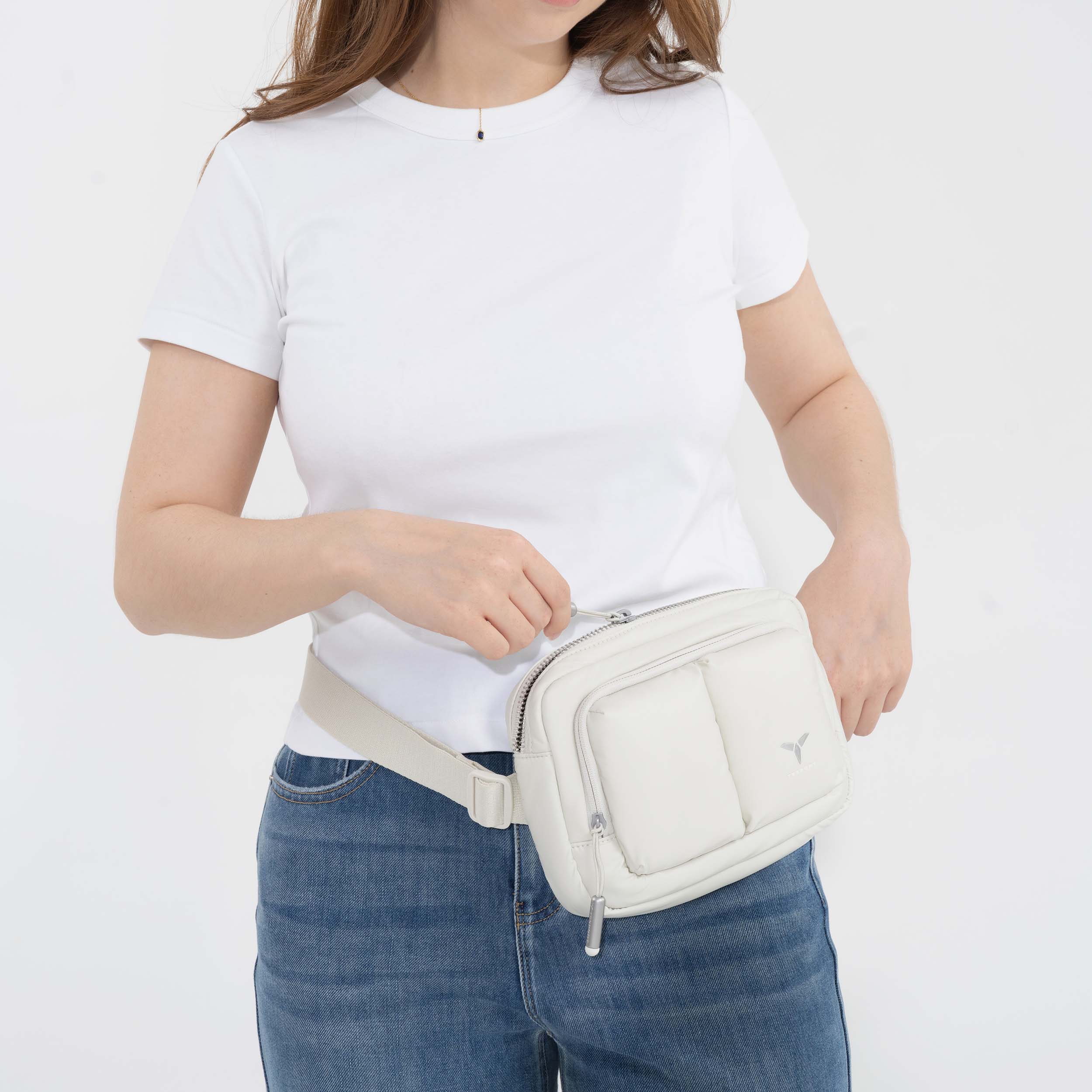 Tesport Cloud Crossbody Belt Bag in White female model unzipping