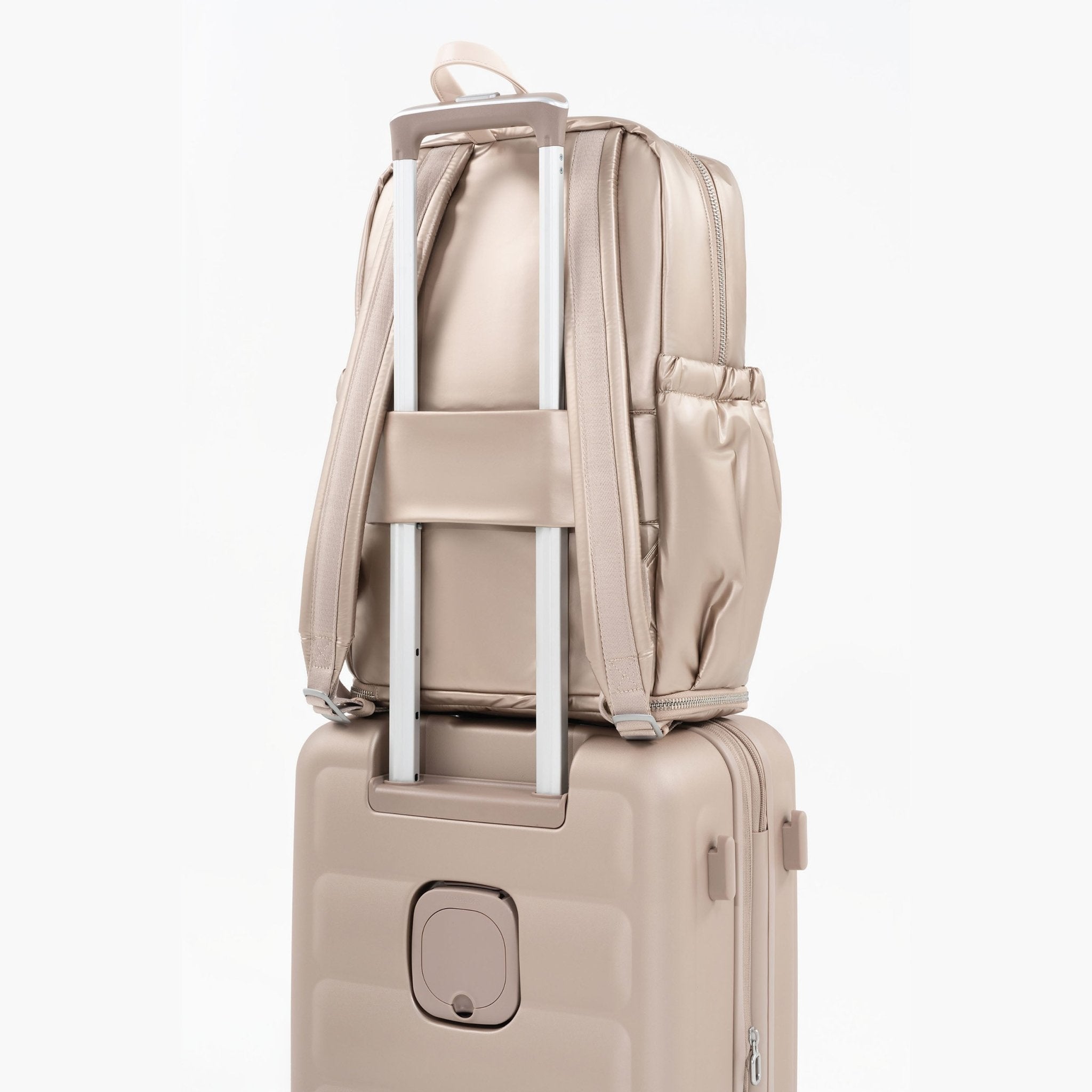 Tesport Cloud Large Backpack in Champagne on top of other luggage