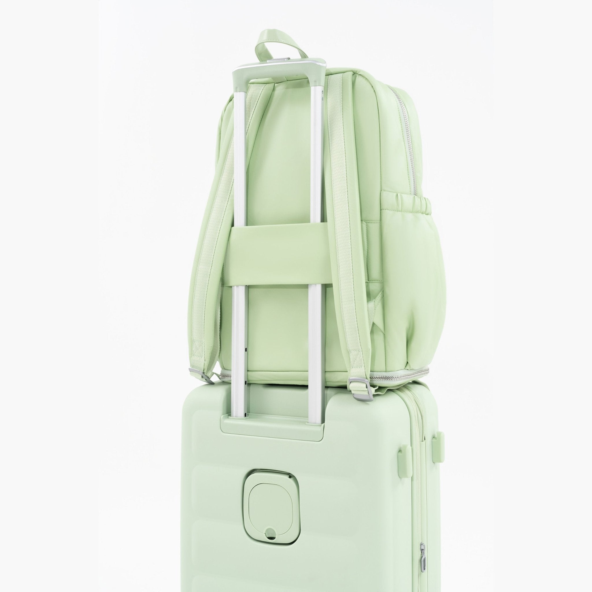 Tesport Cloud Large Backpack in Apple Green on top of other luggage