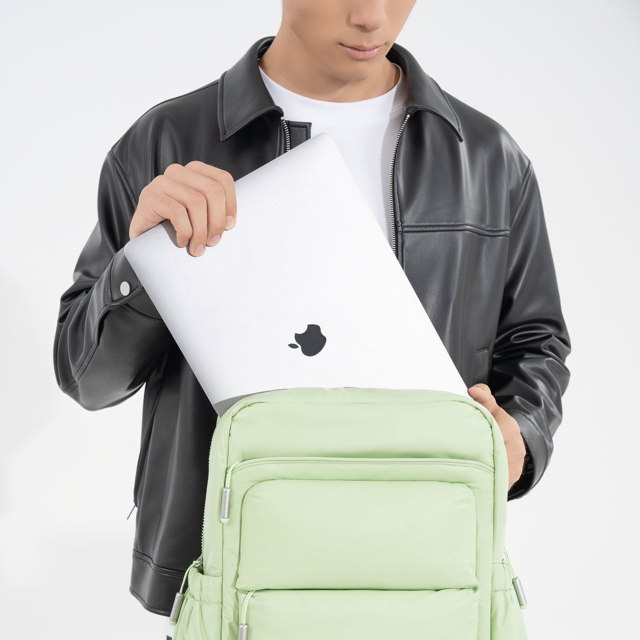 Tesport Cloud Large Backpack in Apple Green holding laptop