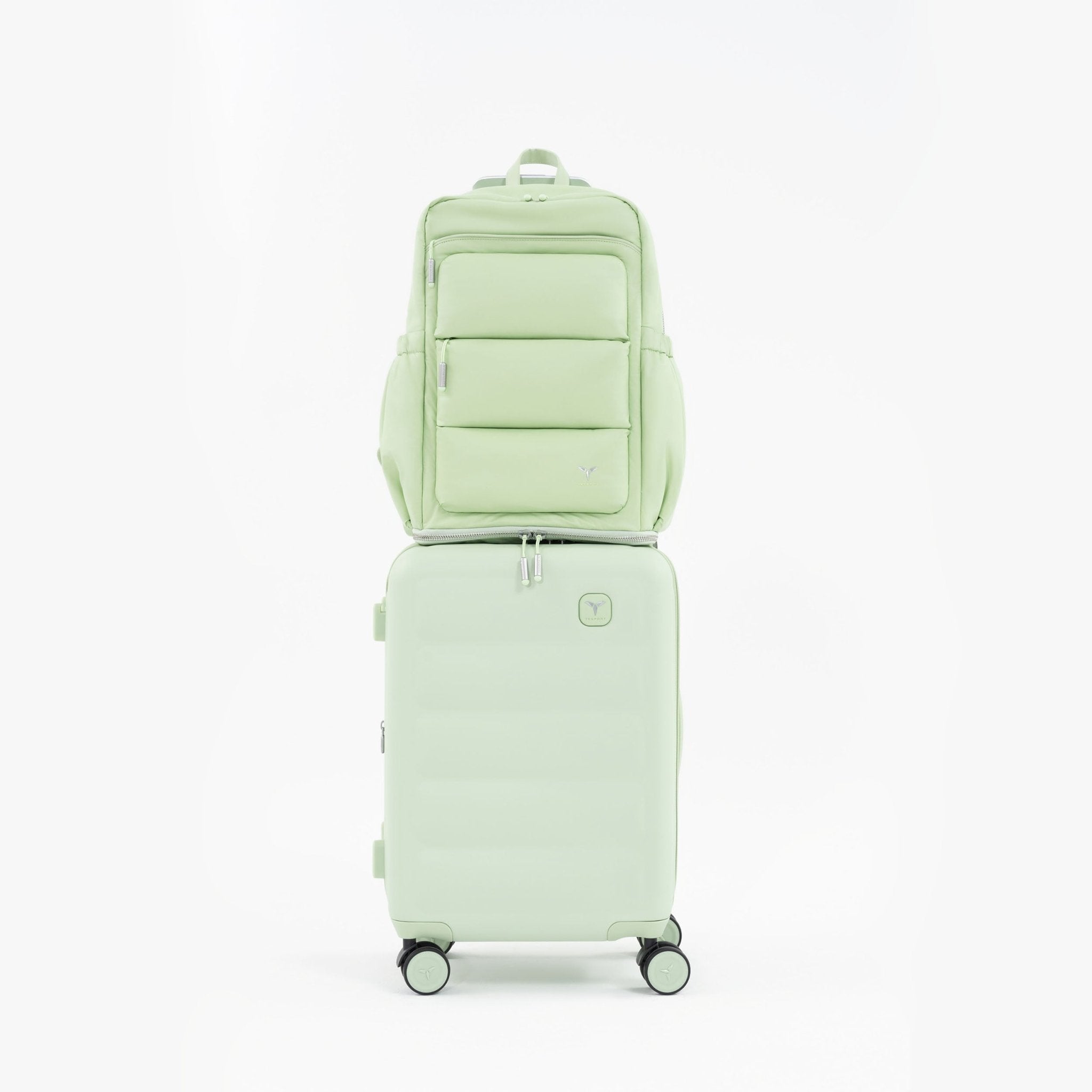 Tesport Cloud Large Backpack in Apple Green on top of other luggage