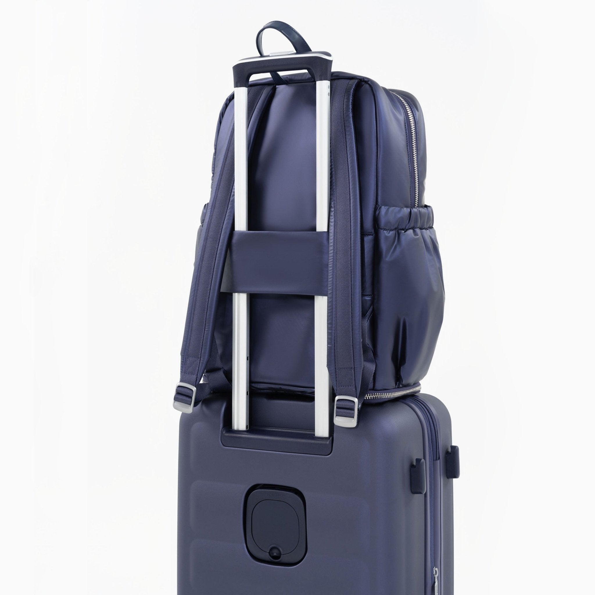Tesport Cloud Large Backpack in Navy on top of other luggage