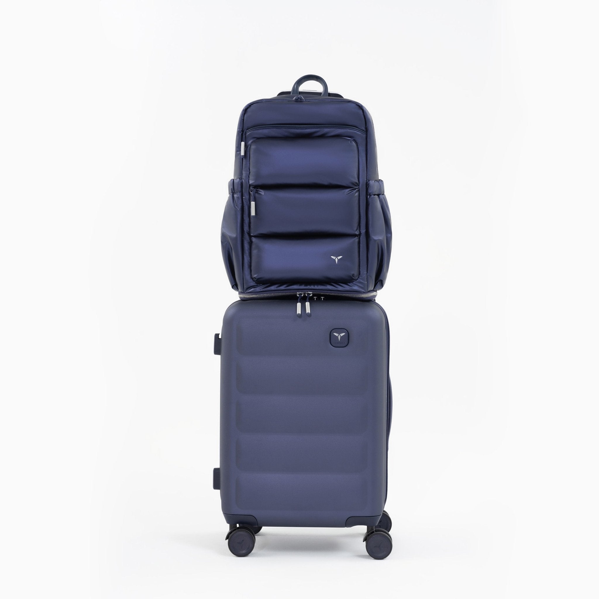 Tesport Cloud Large Backpack in Navy on top of other luggage