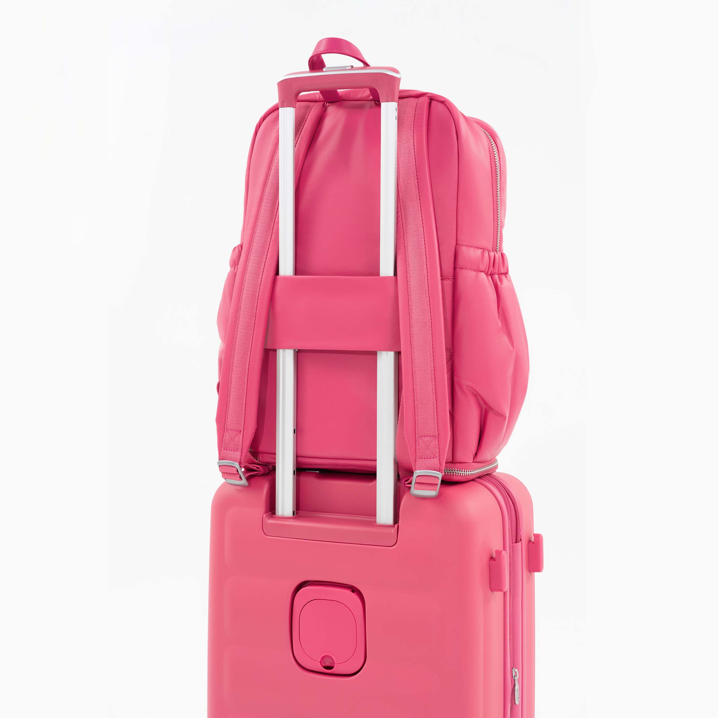 Tesport Cloud Large Backpack in Pink on top of other luggage