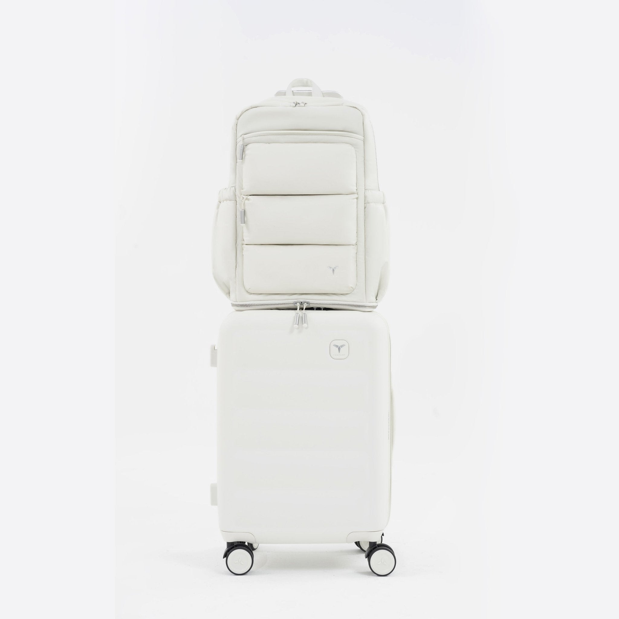 Tesport Cloud Large Backpack in White on top of other luggage