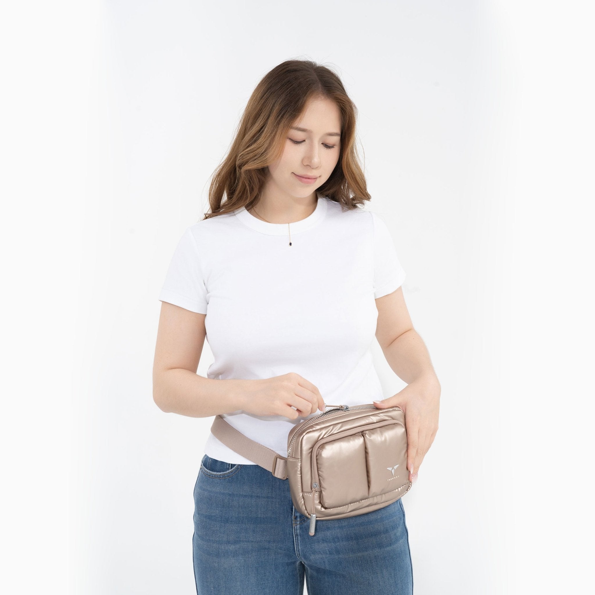 Tesport Cloud Crossbody Belt Bag in Champagne female model unzipping