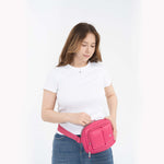 Tesport Cloud Crossbody Belt Bag in Pink female model unzipping