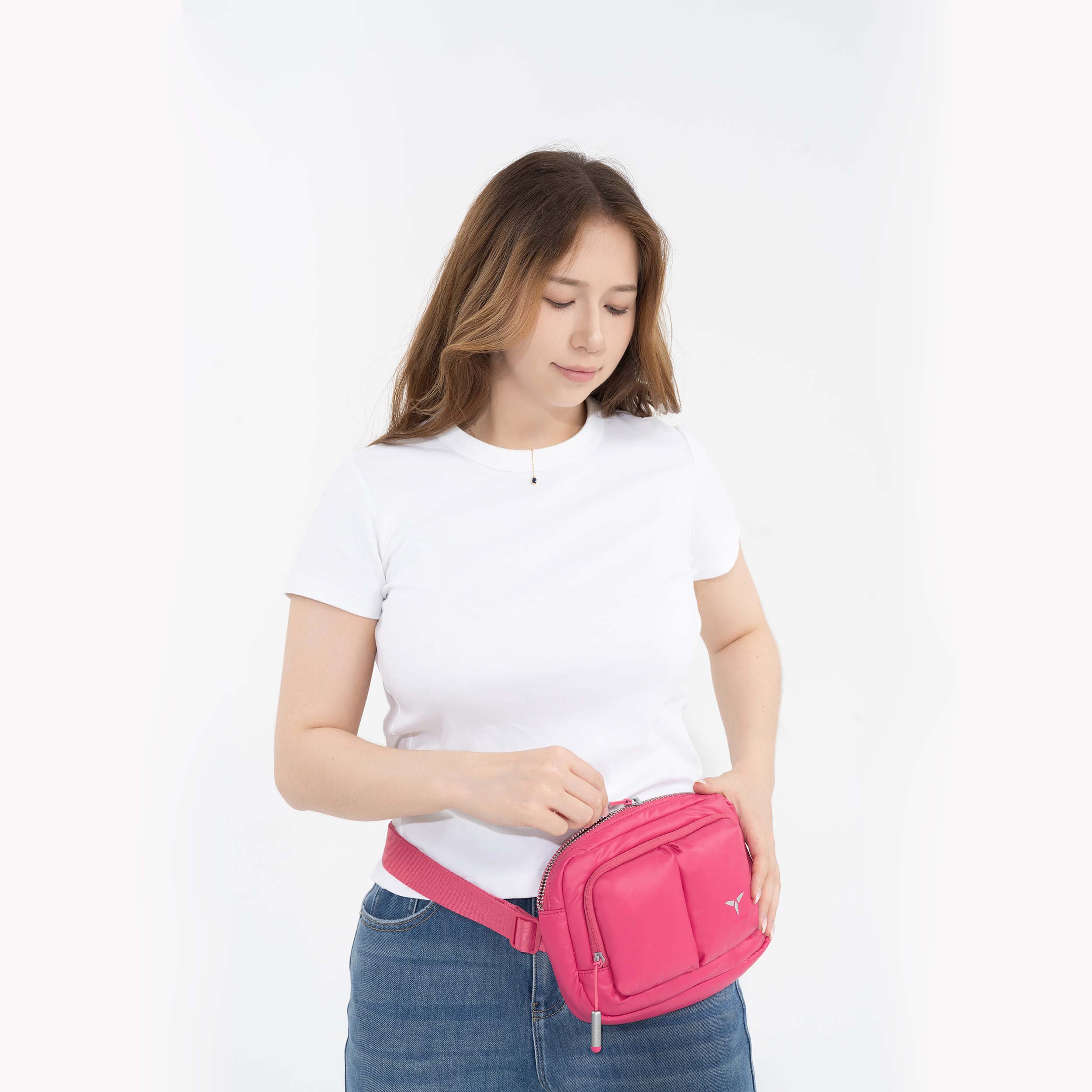 Tesport Cloud Crossbody Belt Bag in Pink female model unzipping