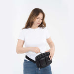 Tesport Cloud Crossbody Belt Bag in Black with female model unzipping