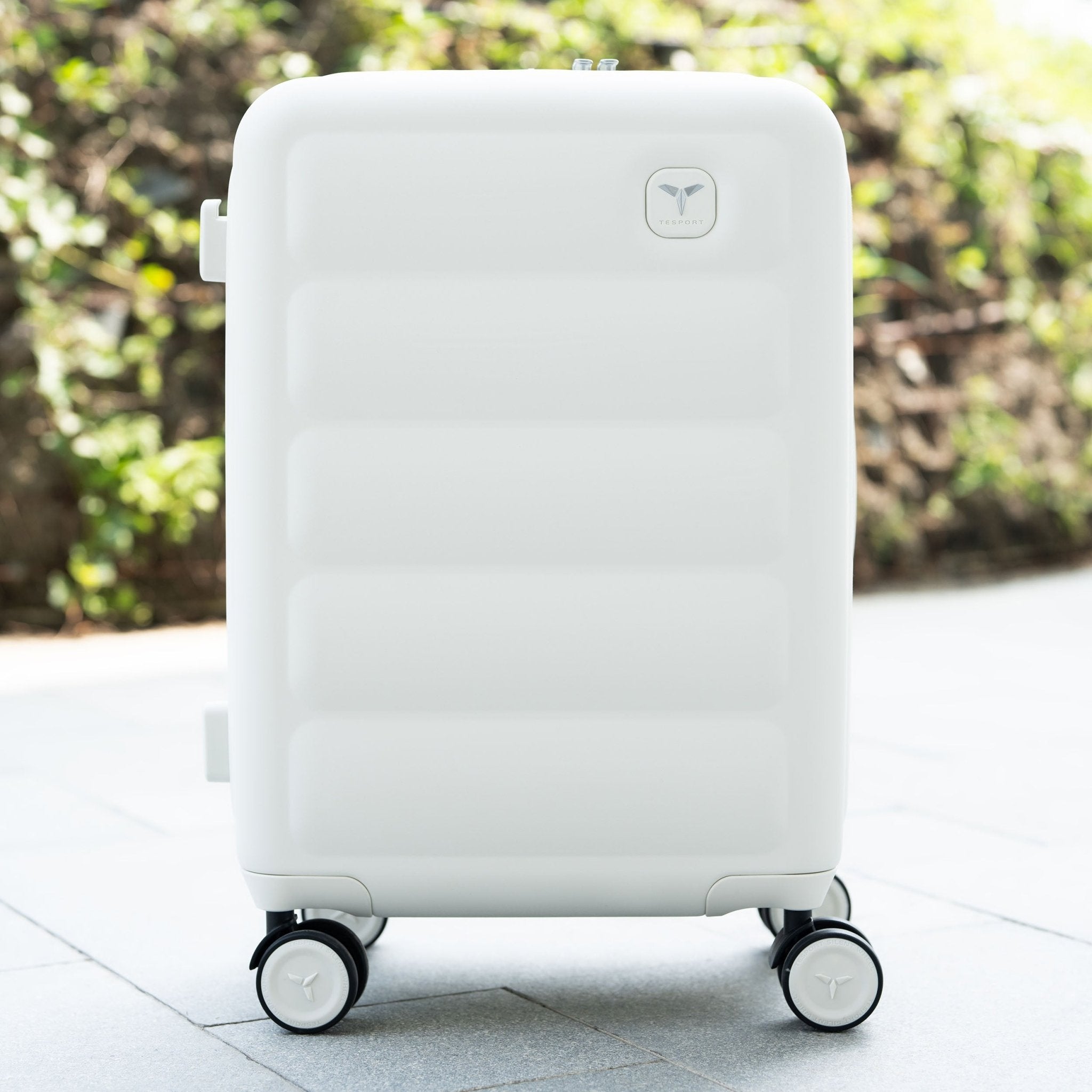 Tesport Cloud Flex Carry-On Luggage in White outdoor lifestyle shot