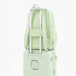 Tesport Cloud Large Backpack in Apple Green on top of other luggage