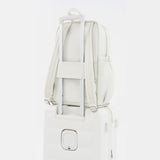 Tesport Cloud Large Backpack in White on top of other luggage