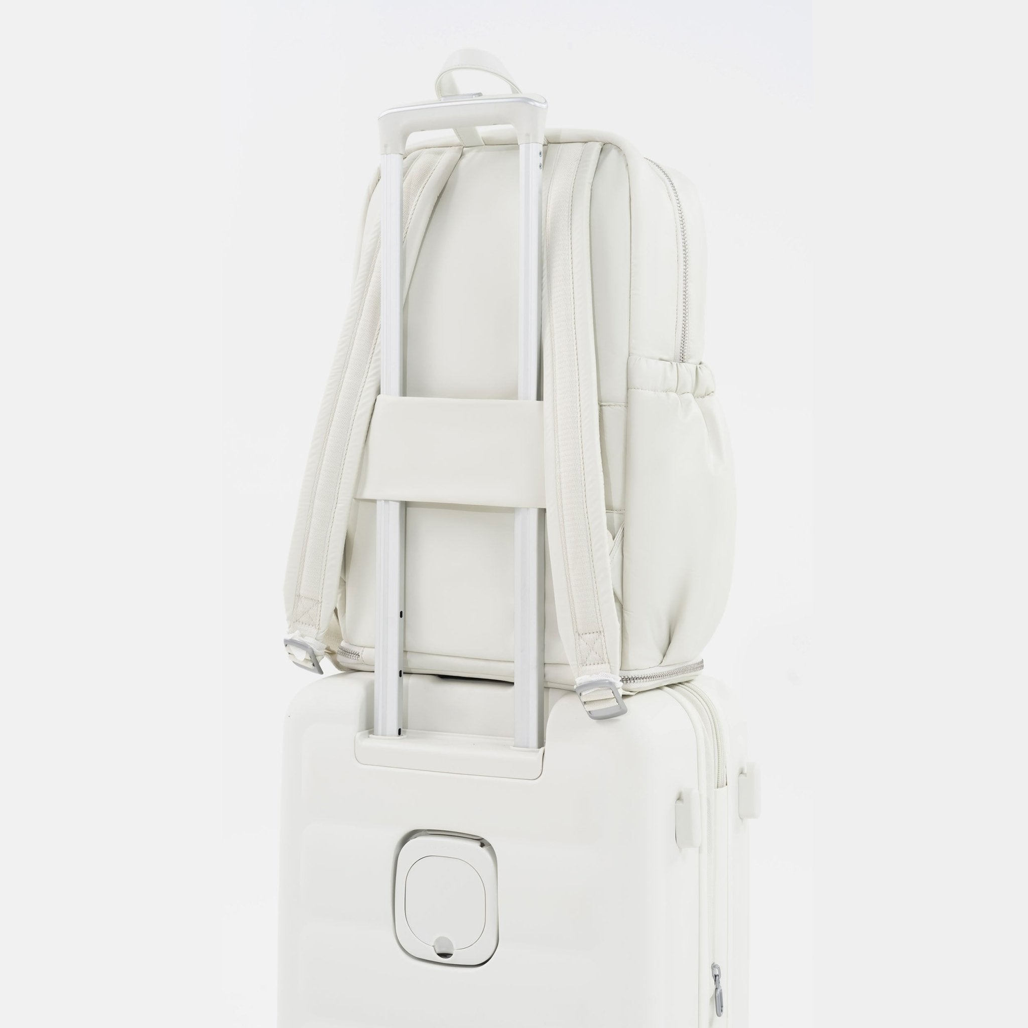 Tesport Cloud Large Backpack in White on top of other luggage