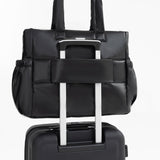 Tesport Cloud Tote in Black on top of other luggage