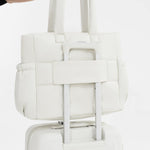 Tesport Cloud Tote in White on top of other luggage
